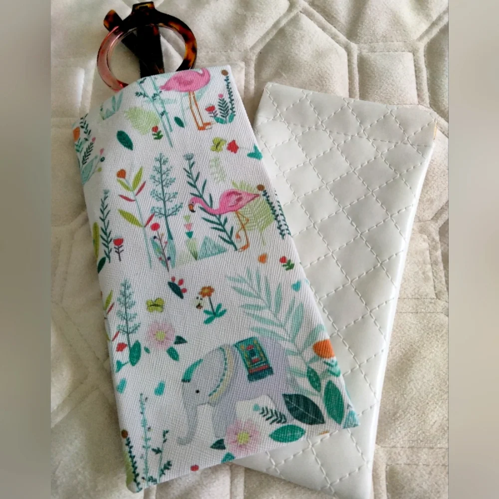 2 Sunglass cases. Snaps open and closed. Protect your glasses. White quilted